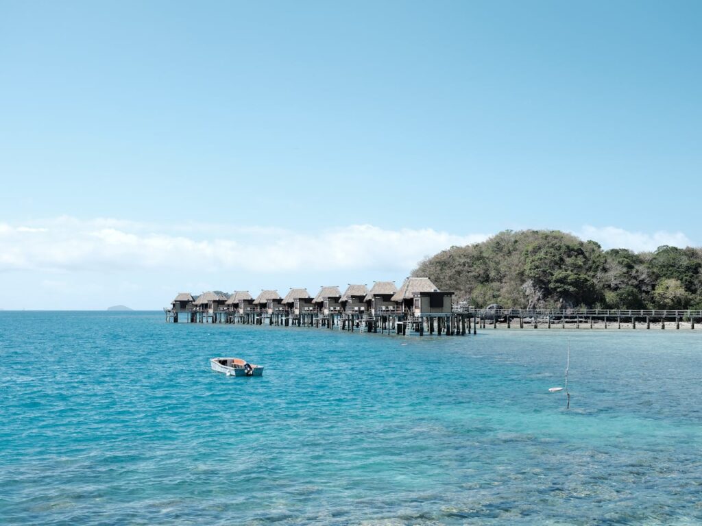 Idyllic overwater bungalows in Fiji with a serene ocean view.
