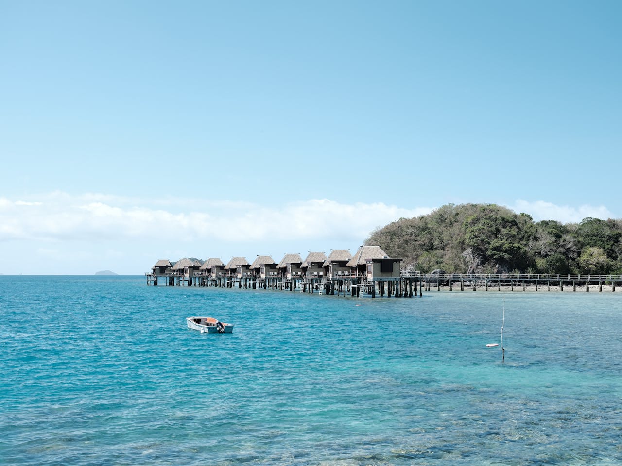 about-us-img Idyllic overwater bungalows in Fiji with a serene ocean view.